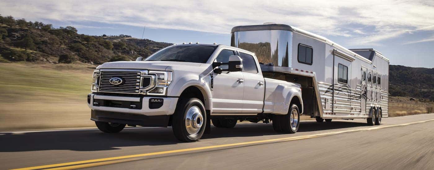 White 2020 Ford F-450 towing a camper