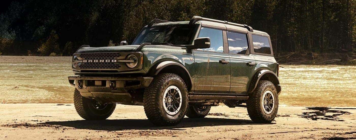 Green 2024 Ford Bronco Badlands parked off-road