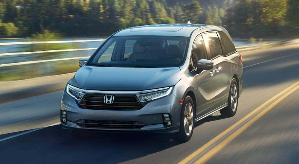 A grey 2020 Honda Odyssey Elite is shown from the front at an angle.
