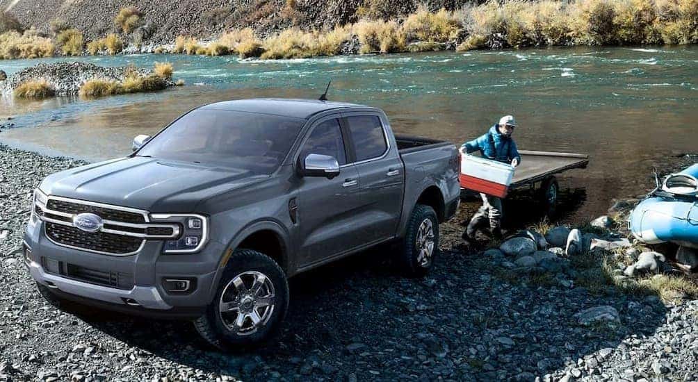 A gray 2024 Ford Ranger is shown parked near a river.