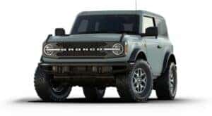 A green 2024 Ford Bronco Badlands is angled left.