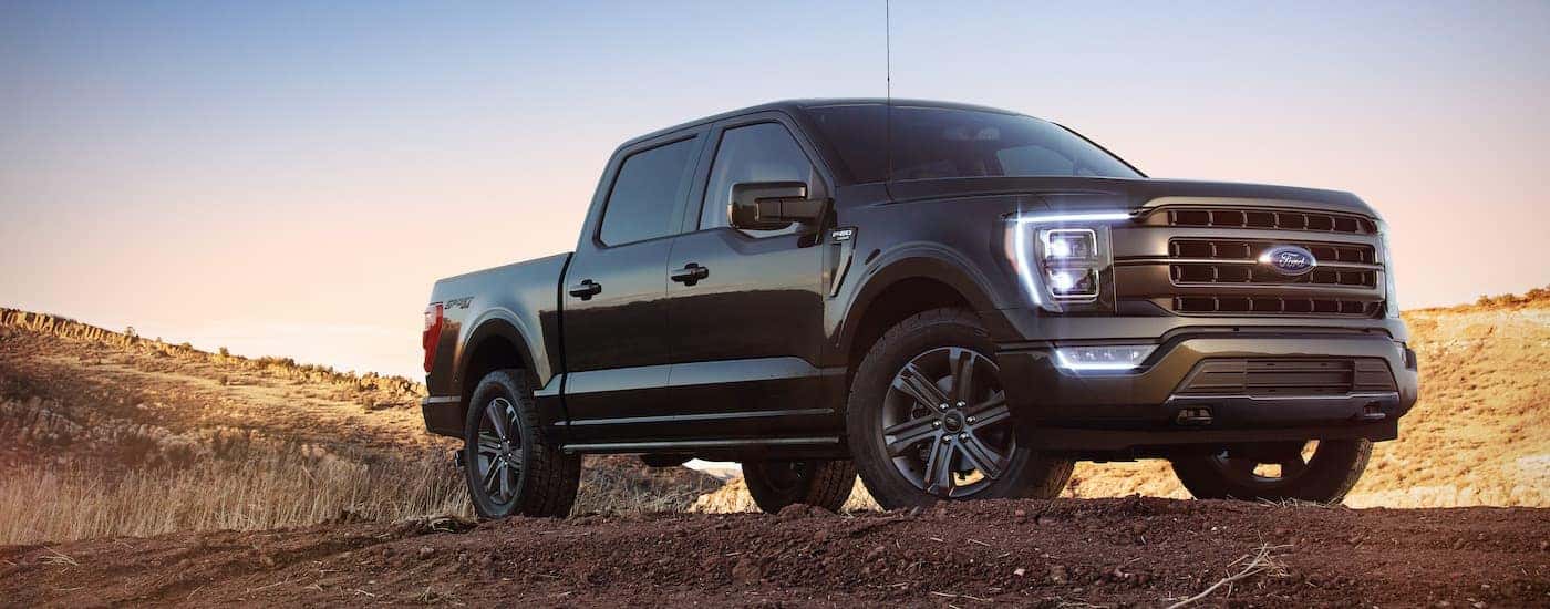 A black 2022 Ford F-150 is shown from the front at an angle.