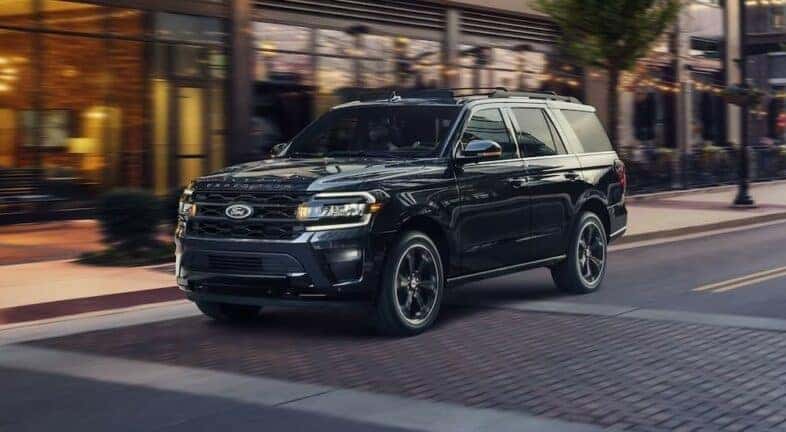 A black 2024 Ford Expedition is shown parked in a city after visiting a Ford dealership near Mechanicville.