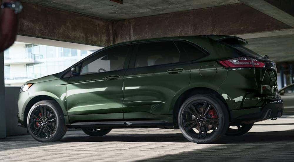 A green 2022 Ford Edge is shown parked in a parking garage.