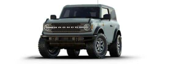 A green 2024 Ford Bronco Badlands angled left.