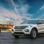 A white 2024 Ford Explorer is shown from the front at an angle.