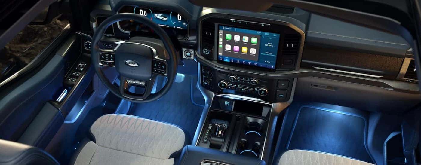 The black and gray interior andd ash in a 2021 Ford F-150 is shown.