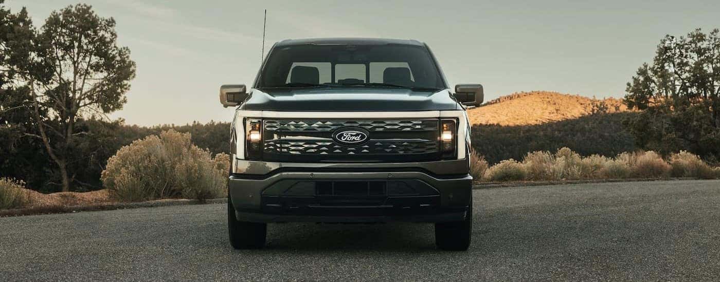 The front angle of a black 2022 Ford F-150 Lightning is shown.