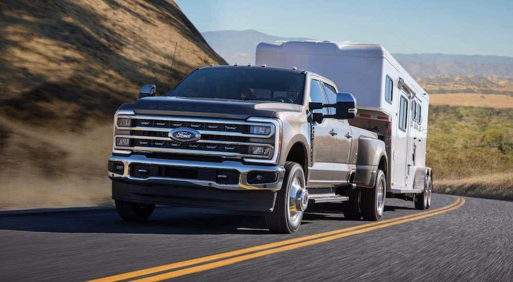 A grey 2024 Ford F-350 Lariat is shown from the front at an angle.