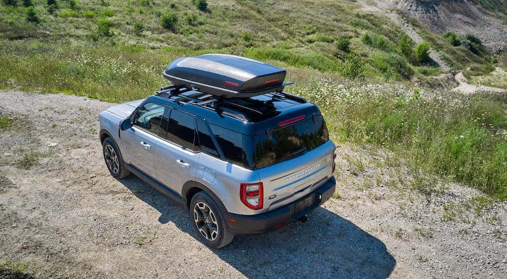 A silver 2024 Ford Bronco Sport is shown from the rear at an angle.