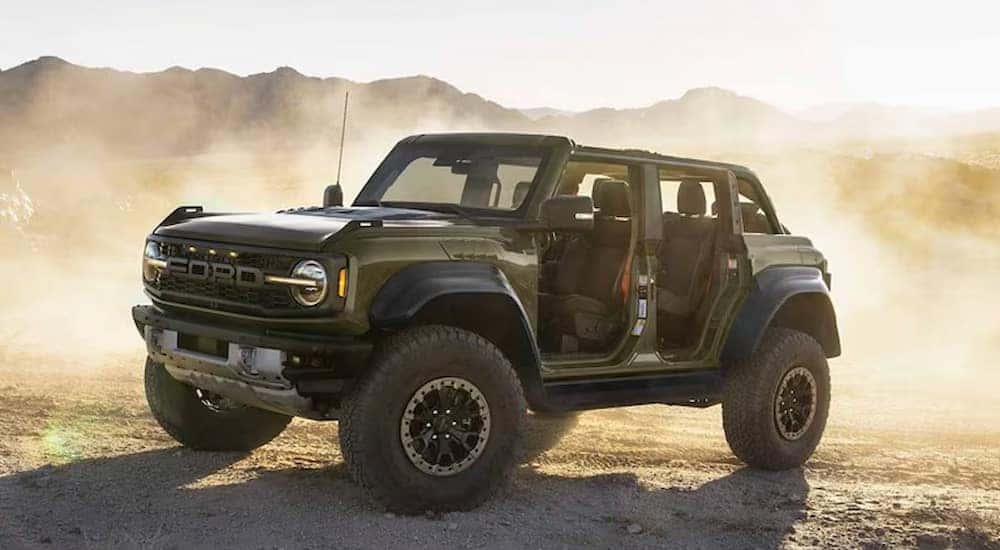 A 2024 Ford Bronco Raptor parked off-road with the doors removed.