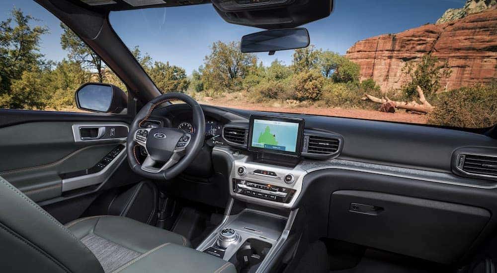 The interior of a 2024 Ford Explorer Timberline is shown from the passenger seat.