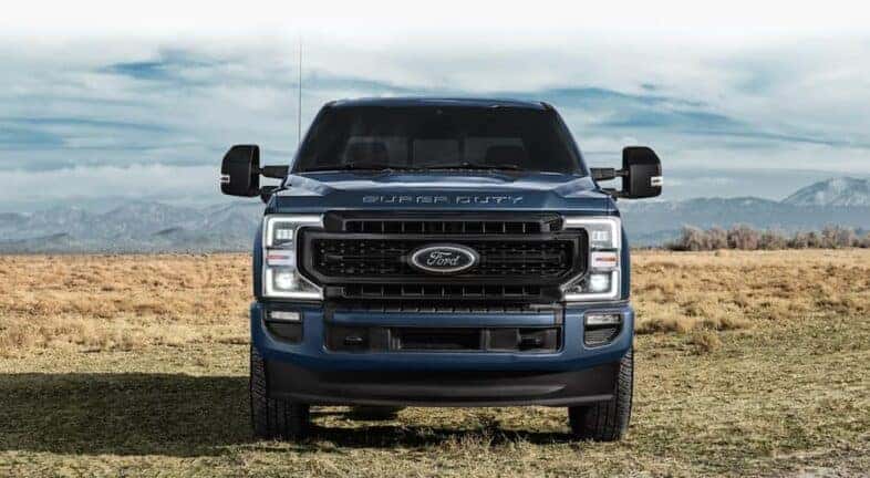 A front view of a dark blue 2021 Ford F-250 Super Duty.