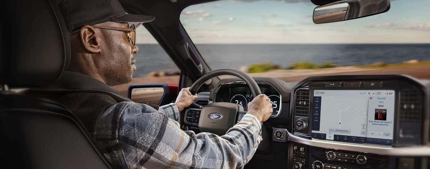 The gray interior and dash in a 2024 Ford F-150 Lariat is shown.