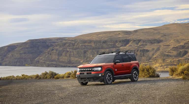 A red 2022 Ford Bronco Sport is shown from the front at an angle.