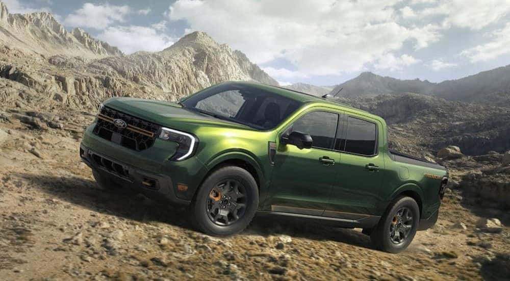 A green 2025 Ford Maverick Tremor is shown off-roading.