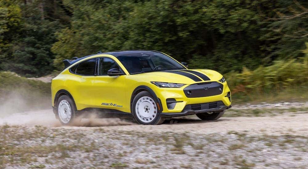 A yellow 2024 Ford Mustang Mach-E Rally is shown from the front at an angle.