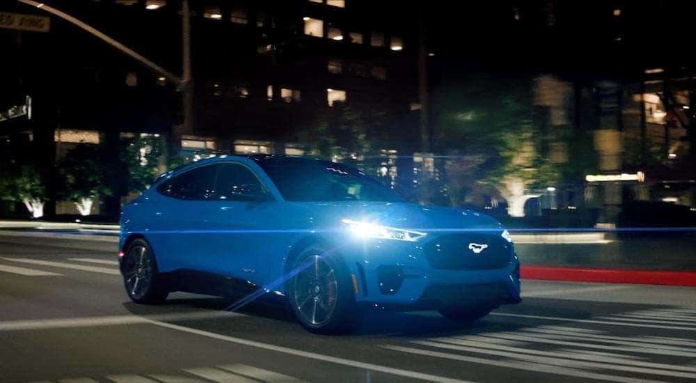 A blue 2023 Mustang Mach-E GT is shown from the front at an angle.
