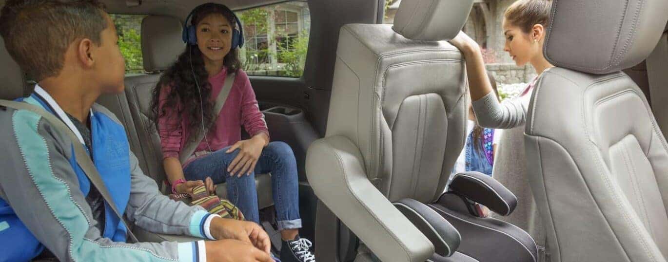 Children are shown sitting in the gray interior of a 2024 Ford Expedition.