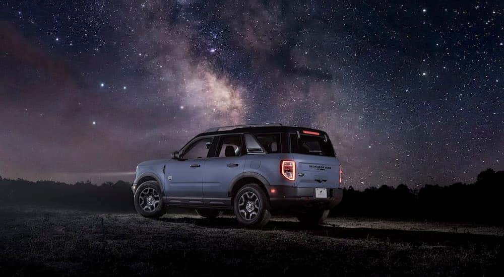 A blue 2022 Ford Bronco Sport is shown from the rear at an angle.