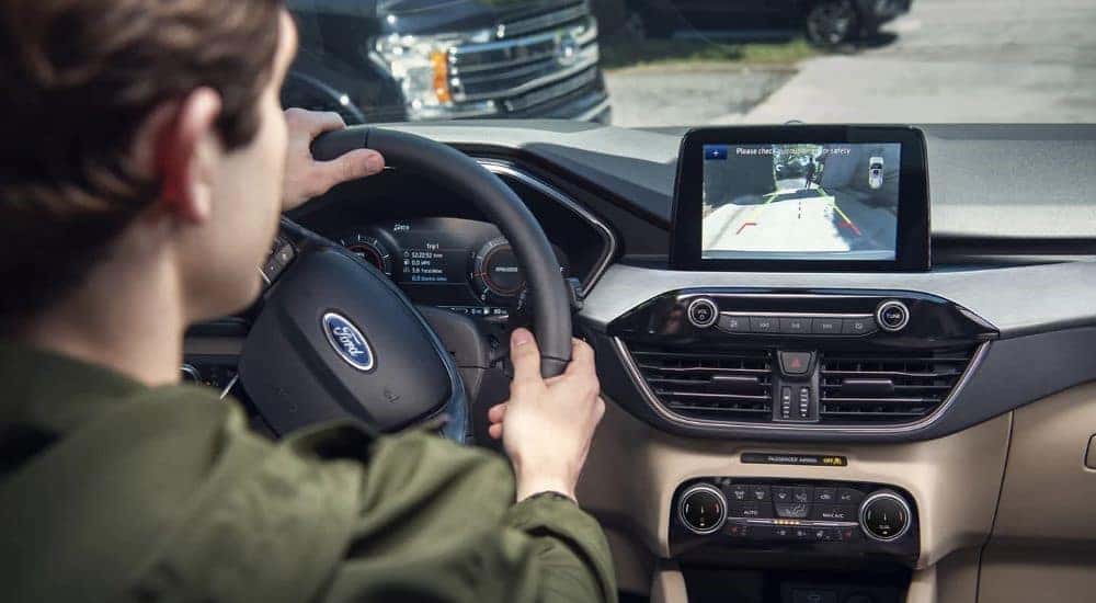 A close-up of the black and tan dash is shown in a 2022 Ford Escape.