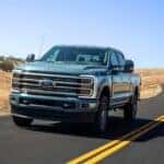 A teal 2025 Ford F-350 Limited is shown from the front at an angle.