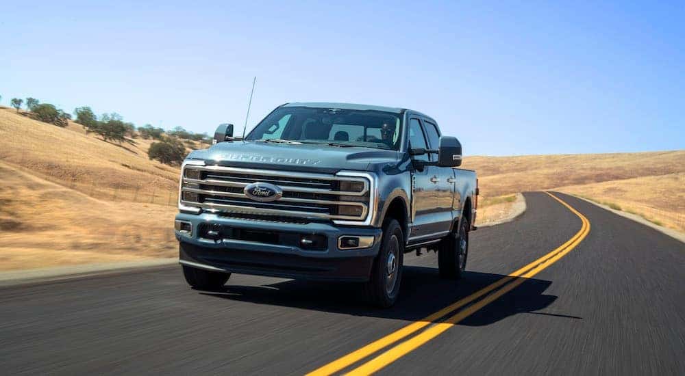 A teal 2025 Ford F-350 Limited is shown from the front at an angle.