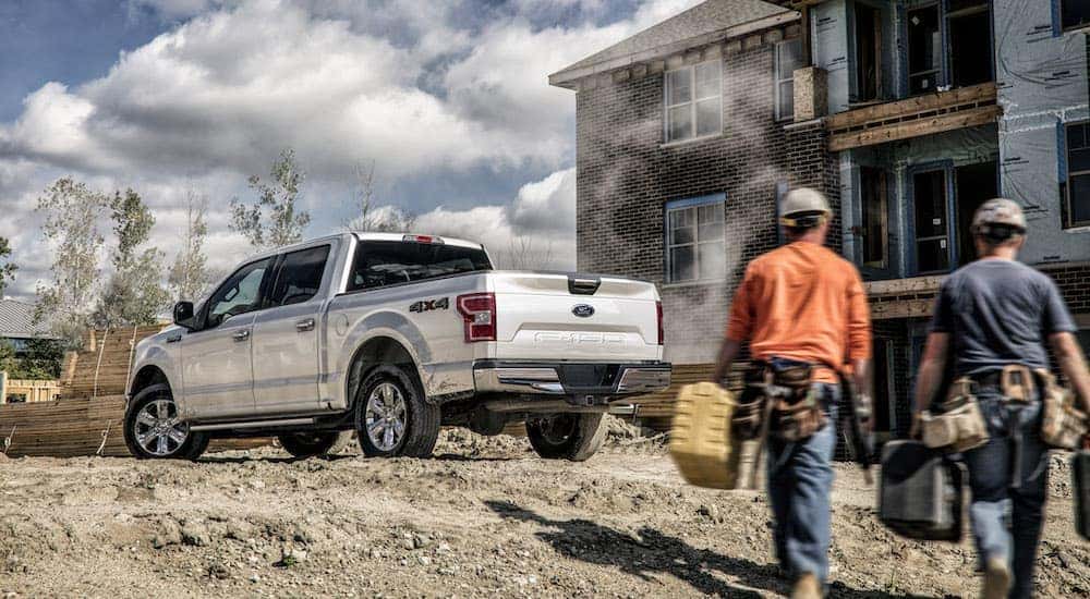 A silver 2020 Ford F-150 is shown from the rear at an angle.