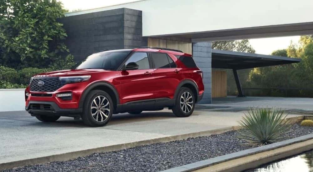A red 2023 Ford Explorer ST-Line is shown parked on a driveway.