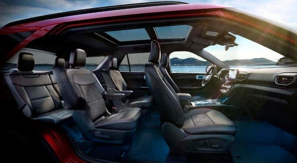 The black interior is shown in a red 2023 Ford Explorer.