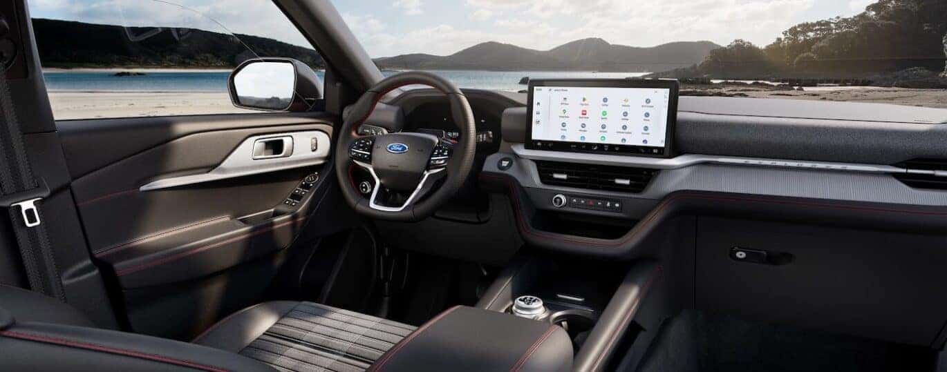 The black interior and dash are shown in a 2025 Ford Explorer ST-Line.
