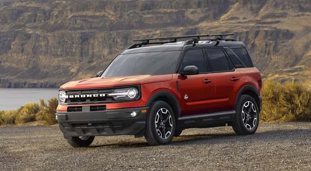 A red 2024 used Ford Bronco Sport for sale in Albany is shown from the front at an angle.
