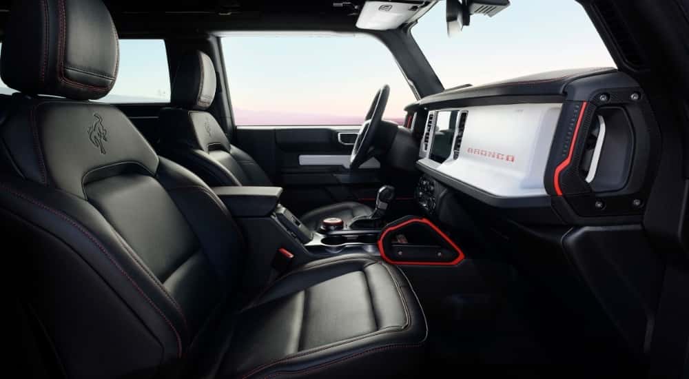 The black interior of a 2025 Ford Bronco Stroppe Edition is shown from the passenger side.