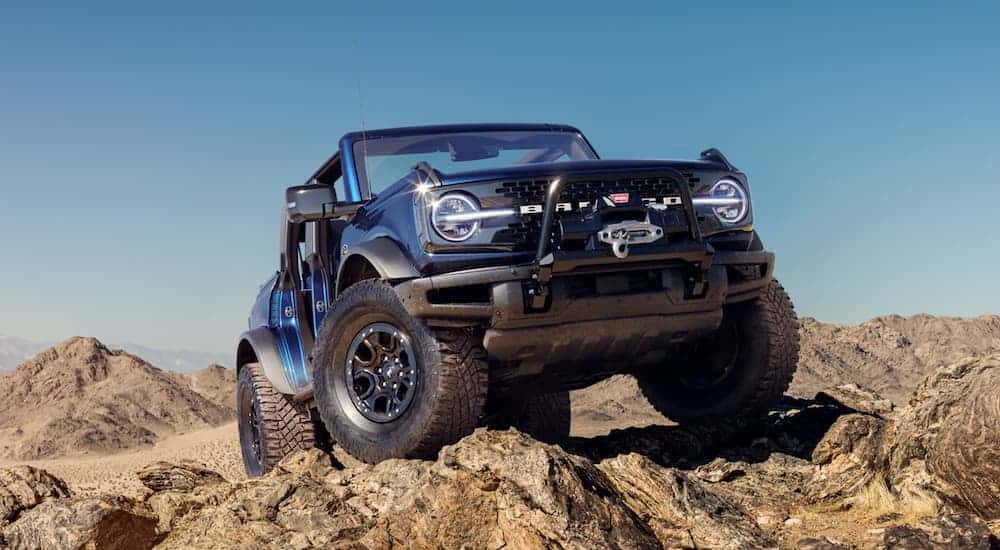 Low angle view of a dark blue 2022 Ford Bronco after leaving a dealer with a used Ford Bronco for sale in Albany.