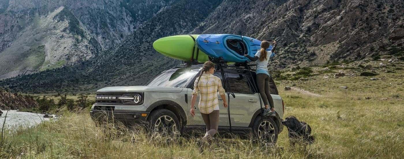 A silver 2024 Ford Bronco Sport is shown parked off-road after viewing a used Ford for sale near Cohoes.