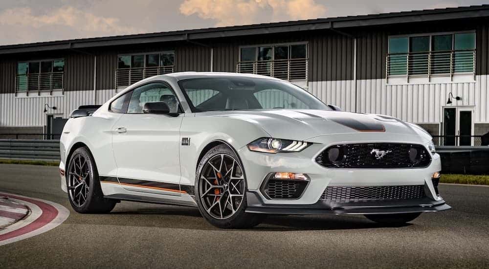 A grey 2023 Ford Mustang Mach-E is shown from the front at an angle.