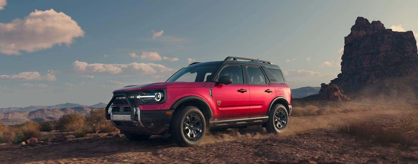 A red 2025 Ford Bronco Sport Badlands off-roading.