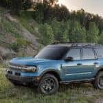 A blue 2025 Ford Bronco Sport parked off-road.