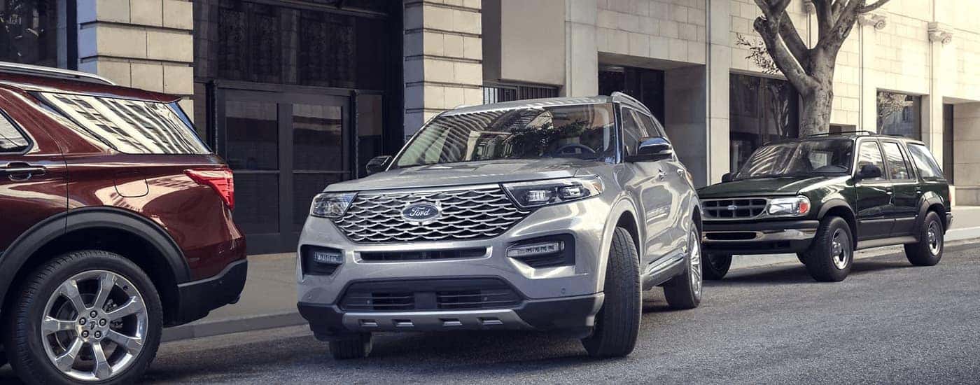 A silver 2023 used Ford Explorer for sale near Troy is shown from the front at an angle.
