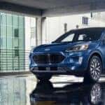 A blue 2020 used Ford Escape for sale in Albany parked in a city.