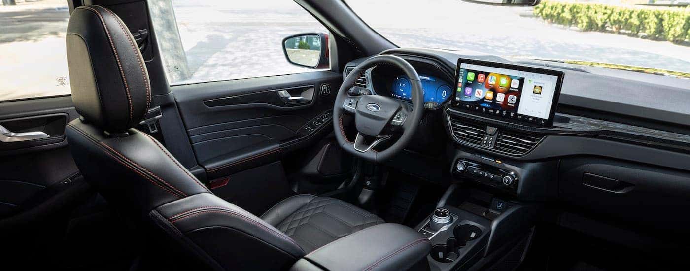 The black interior of a 2023 Ford Escape ST-Line.