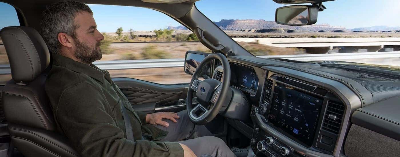 The black interior and dash in a 2025 Ford F-150 STX.