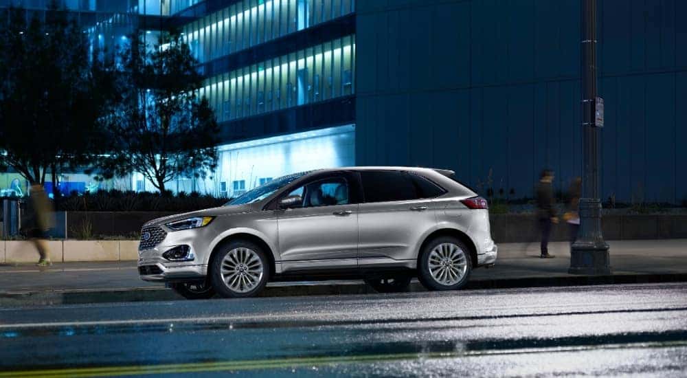 A silver 2022 Ford Edge from the side.
