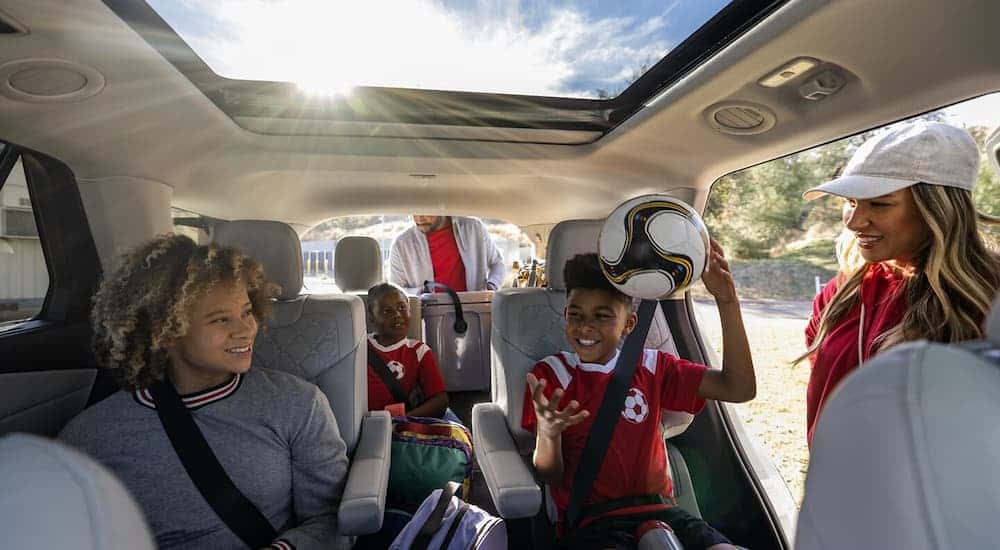 Group of kids in soccer gear in a 2025 Ford Explorer.