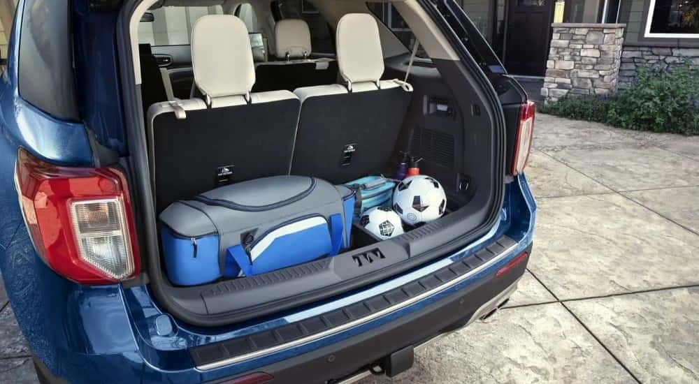 Sport gear in the back of a blue 2021 Ford Explorer.