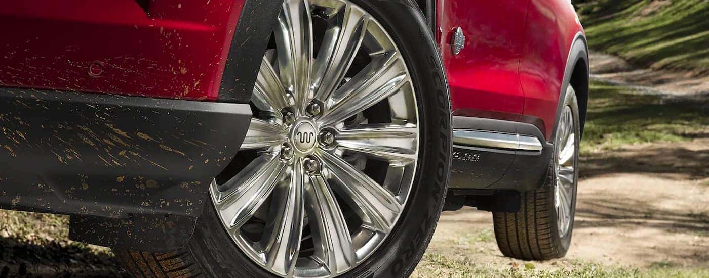 Close-up on the wheel of a red 2023 Ford Explorer King Ranch.
