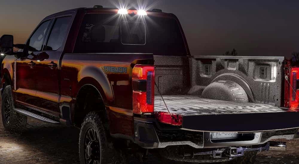 Illuminated bed on a red 2025 Ford F-250.
