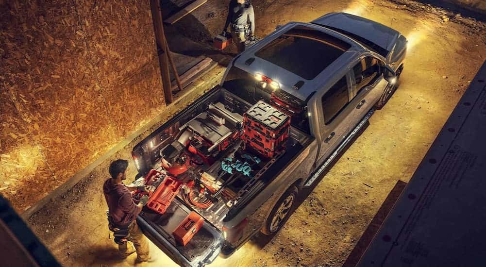 Aerial view of tools in the bed of a silver 2025 Ford F-150 Lightning.