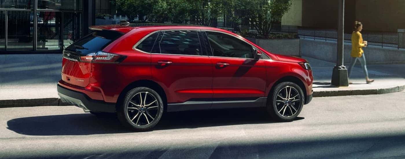 A red 2020 Ford Edge parked in a city.