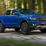 A blue 2019 Ford Ranger from the side after leaving a dealer that has used trucks for sale near Latham.